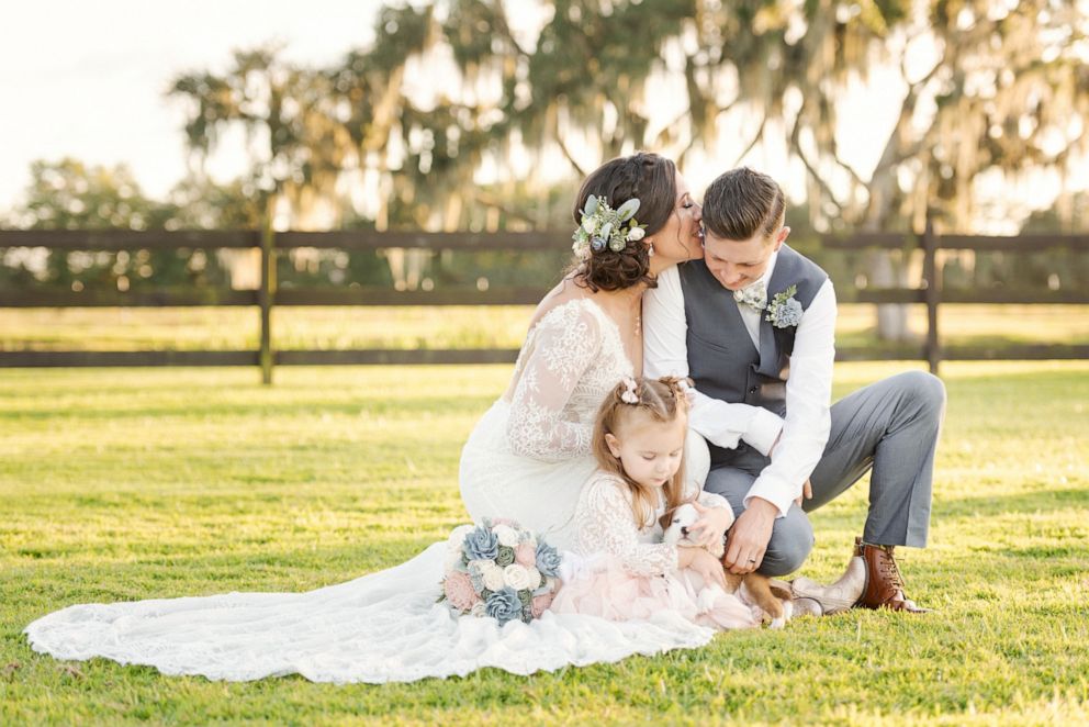 PHOTO: The family of three adopted a puppy from their wedding and named him Swift after Taylor Swift who their daughter loves.