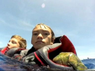 VIDEO: Coast Guard came to the aid of four teens and four adults after their boat was overcome by huge waves.