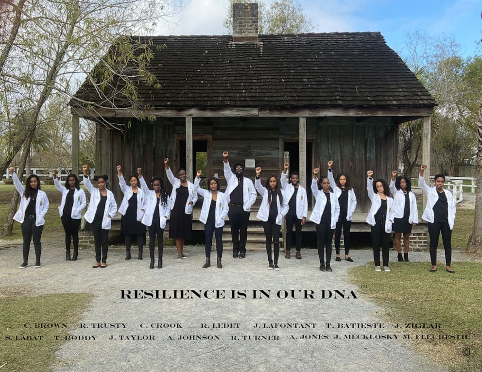 PHOTO: Dr. Russell Ledet, co-founder of "The 15 White Coats," stands alongside fellow students from Tulane University's Student National Medical Association in front of a former plantation on Dec. 14, 2019.
