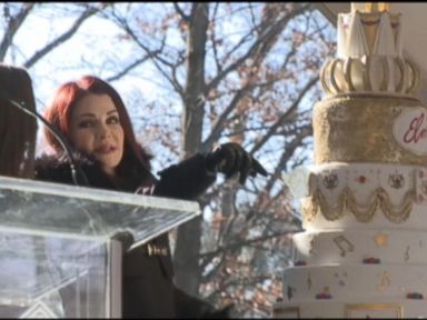 VIDEO: Elvis Presley's ex-wife braved the cold to cut a slice of cake during a celebration of the singer's 80th birthday at Graceland.