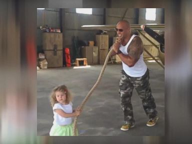 VIDEO: The Rock Helps a 2-Year-Old Pull a Plane 'All by Herself'