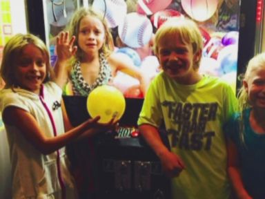 VIDEO: Juliette Grimes needed the help of firefighters after her older sister dared her to get a ball out of the claw machine.