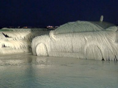 VIDEO: A car was found covered in a thick sheet of ice after being parked on a New York road near Lake Erie.