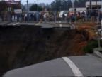 VIDEO: A road in Oregon has crumbled away after a huge sinkhole opened up on the other side of the road where a sinkhole appeared last month, according to police.