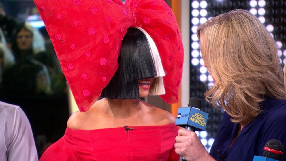 Sia Reveals Her Face After Wind Blows Her Wig