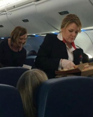 VIDEO: Delta gives out free pizza after cancelling 300 flights