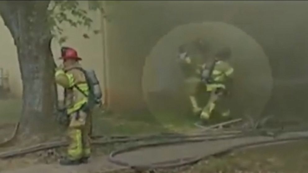 Firefighter catches baby tossed from second floor window of burning ...