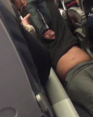 VIDEO: United Airlines settles with passenger dragged from flight