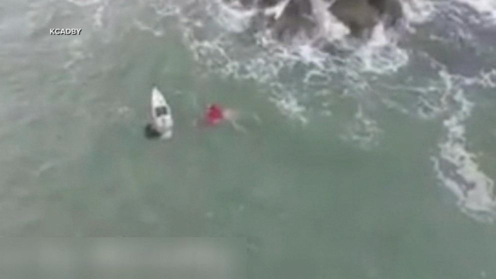 Florida surfer's dramatic rescue of boater from capsized vessel ...