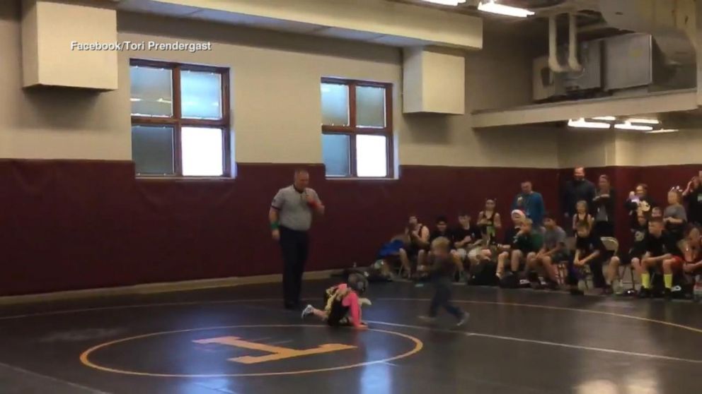 VIDEO: Little brother mistakes his sister's wrestling match for a real fight