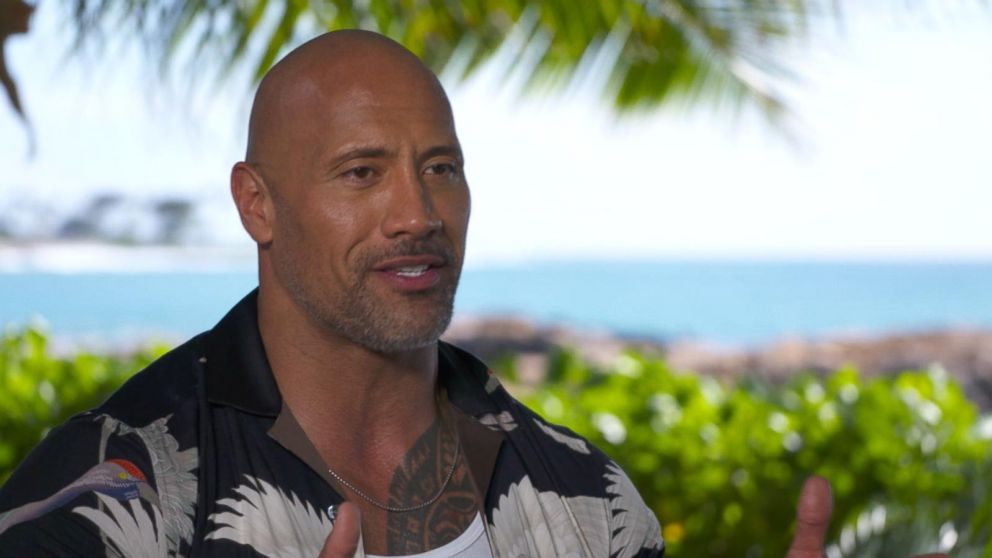 Dwayne 'The Rock' Johnson helps a 2-year-old pull a plane: see the video