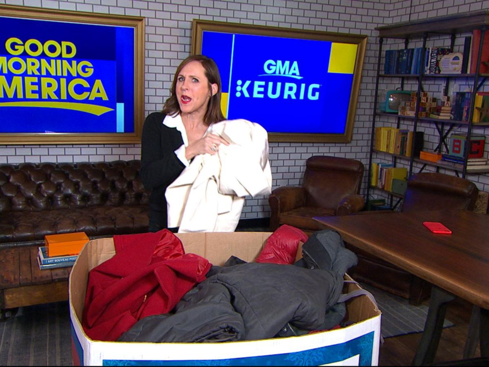 Molly Shannon donates a coat to the Burlington coat drive 