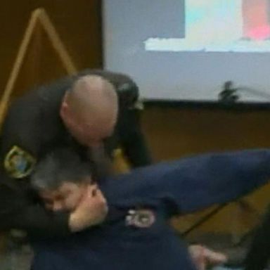 VIDEO: Victims' father lunges at Larry Nassar in court