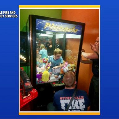 VIDEO: Child gets stuck in claw toy machine