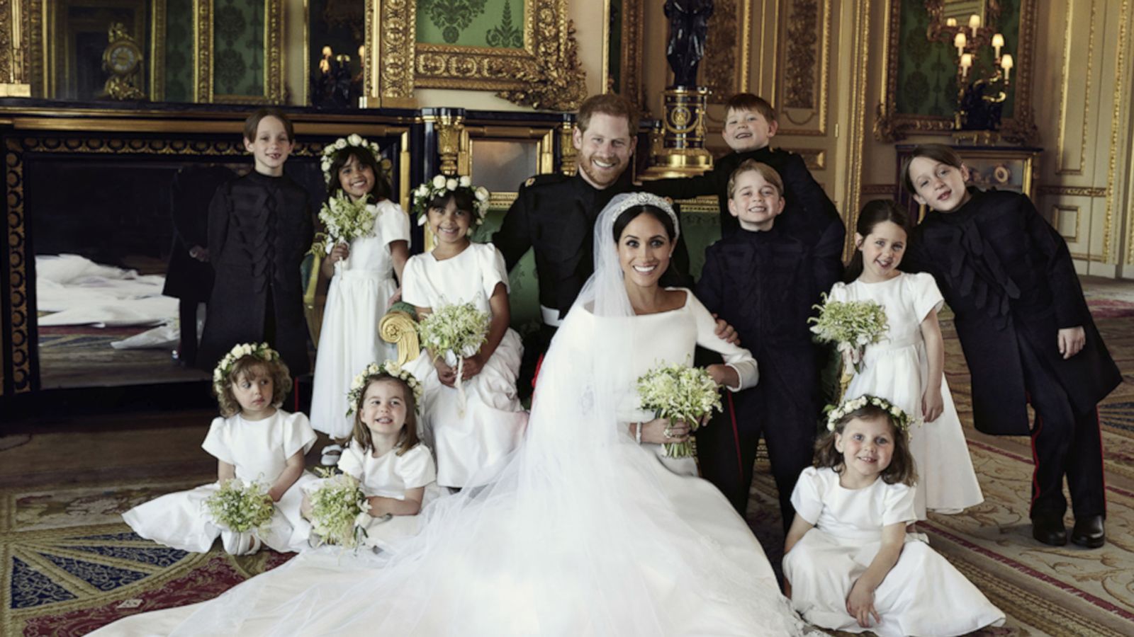 VIDEO: Prince Harry and Meghan Markle smile next to beaming Prince George, Princess Charlotte in official wedding photos