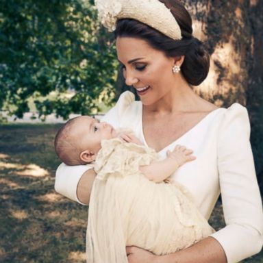 VIDEO: Princess Charlotte can be seen holding her baby brother's hand in one photo.