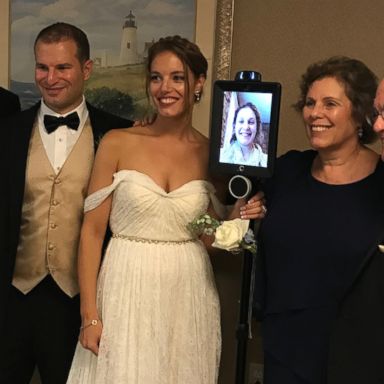 VIDEO: Devoted maid of honor refuses to miss sister's wedding, so she uses a robot to give her speech