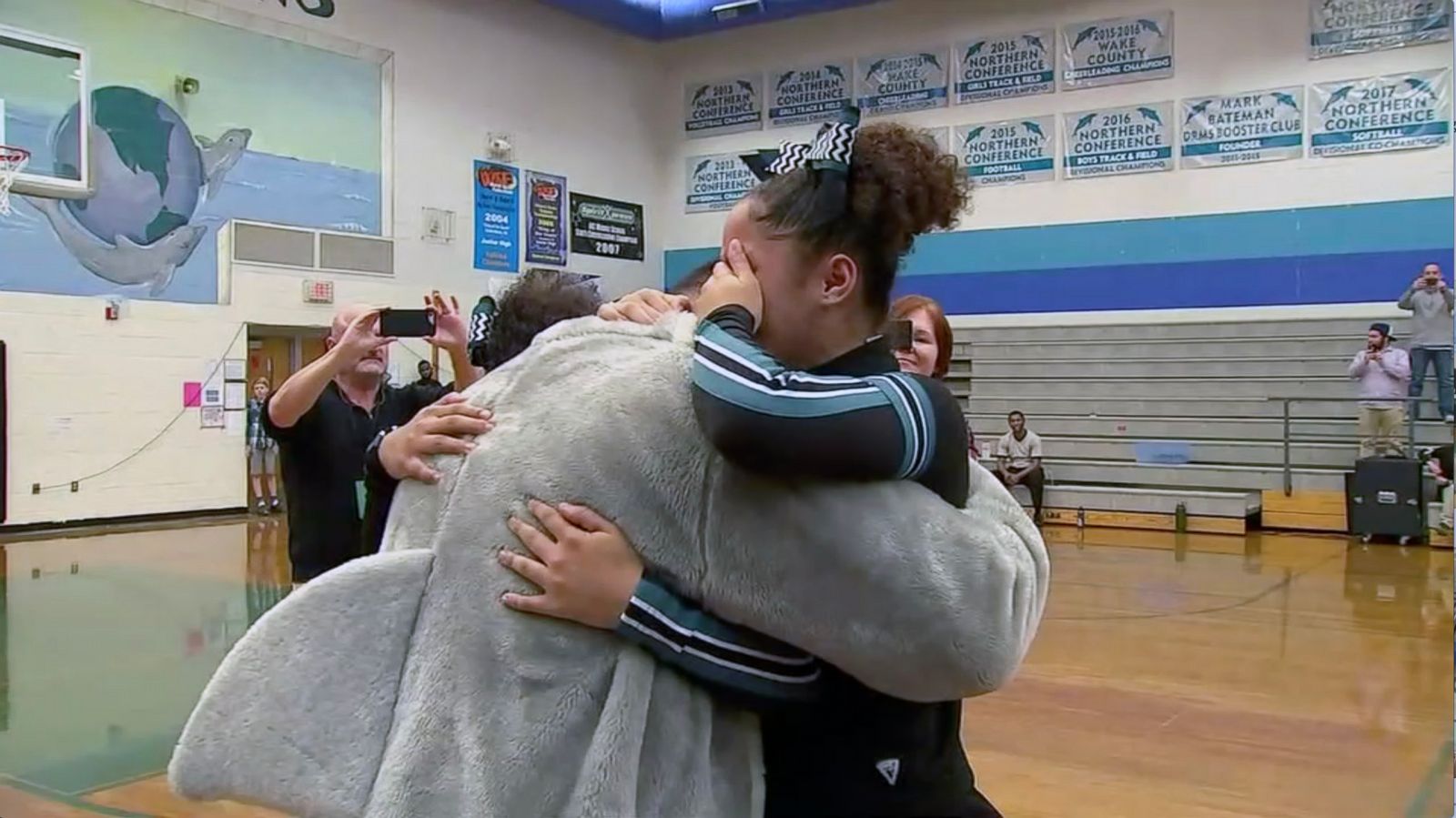 VIDEO: Sisters burst into tears as school mascot is revealed to be military dad