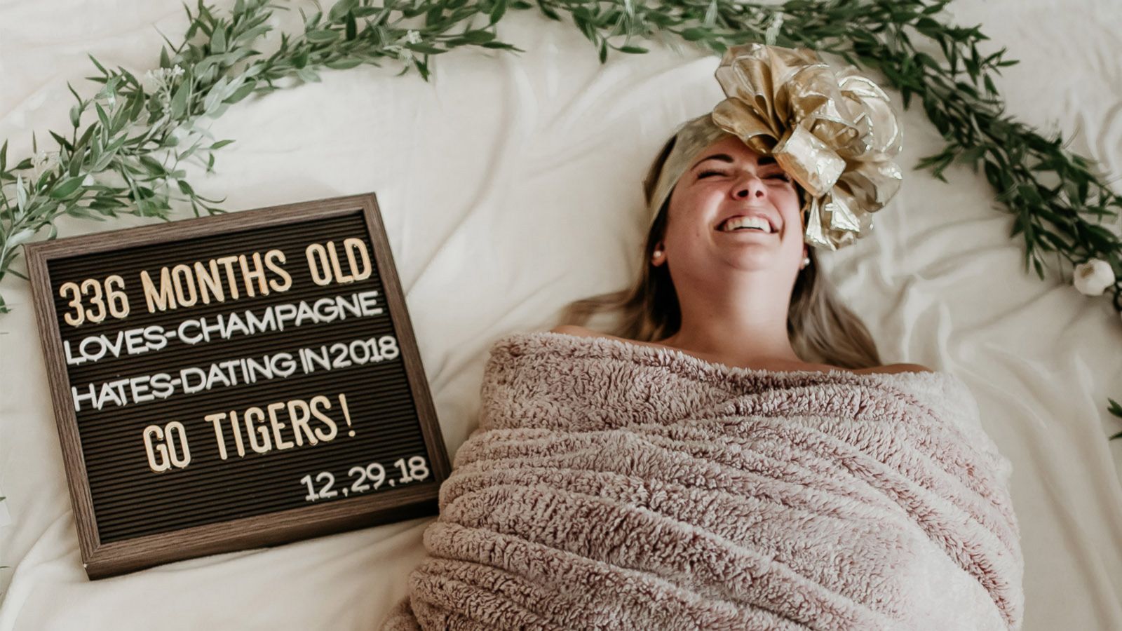 Woman Poses In Swaddle For Hilarious 336 Month Birthday Photo