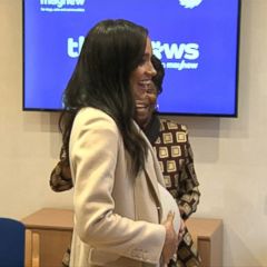 Meghan Markle holds dogs at animal charity visit