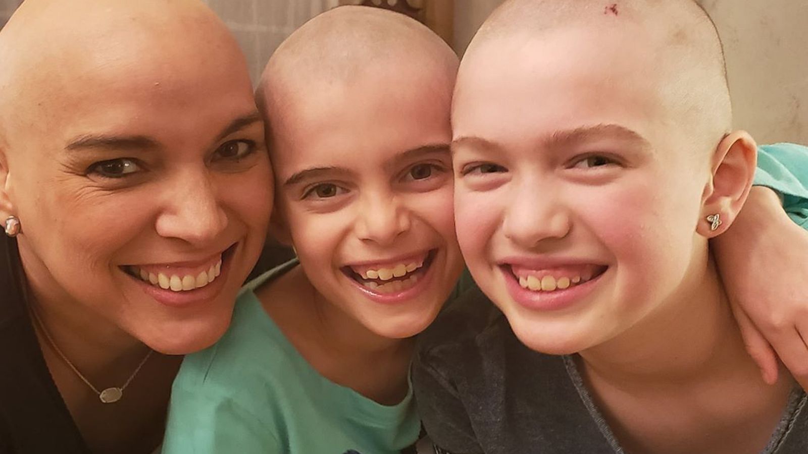 VIDEO: Sisters shave off hair so mom with breast cancer won't have to fight alone