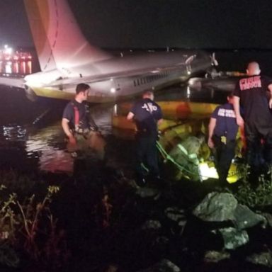 VIDEO: Passengers seen stranded on wings of crashed plane 