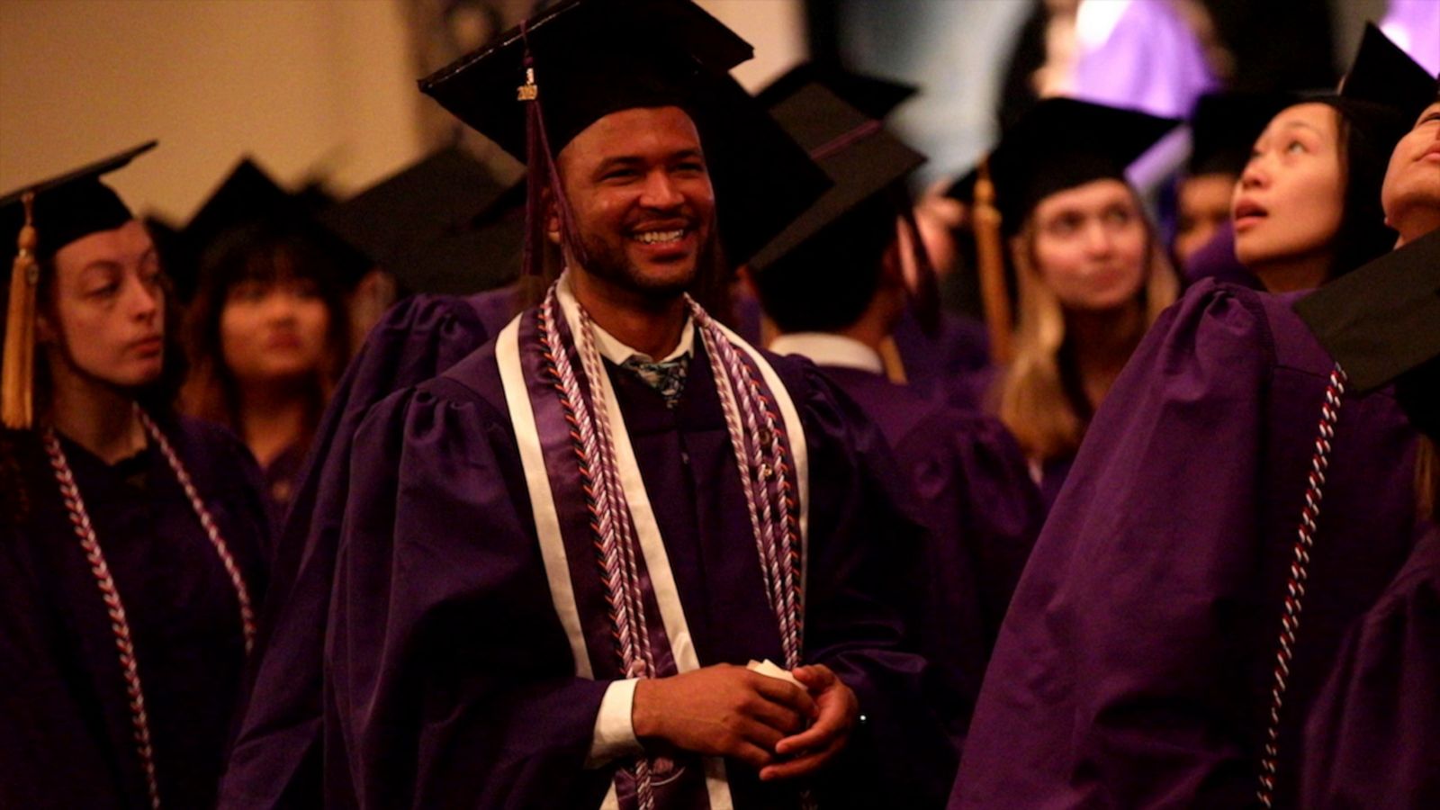 Master degree. Graduates Lawn. American Graduation Color album photo. Male Graduates standing Night.