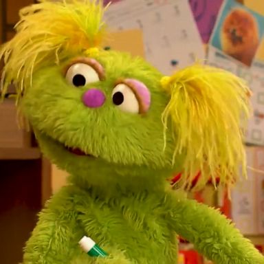 "Sesame Street" has introduced a new friend named Karli -- a young Muppet in foster care, and her "for-now" parents, Dalia and Clem.