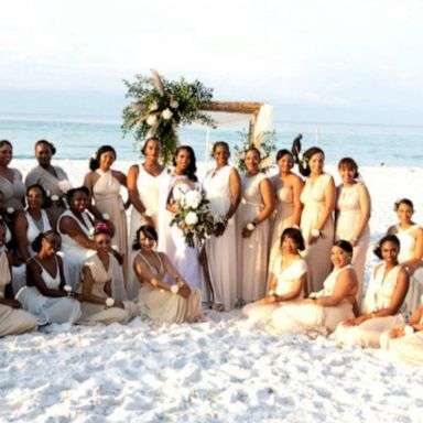 VIDEO: Woman has 34 bridesmaids by her side on her wedding day