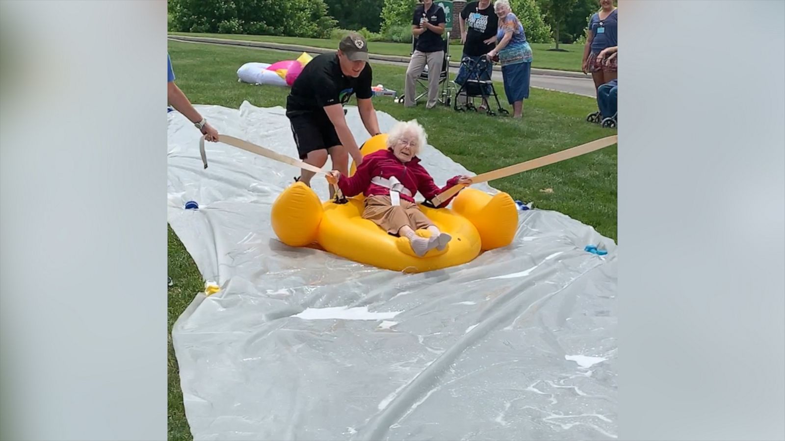 VIDEO: Senior citizens slip and slide into the summer in viral video