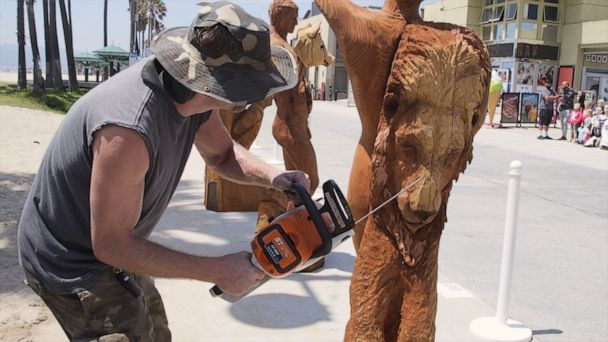 Video Chainsaw artist Stacy Poitras carves seven deadly sins as an act of protest - ABC News