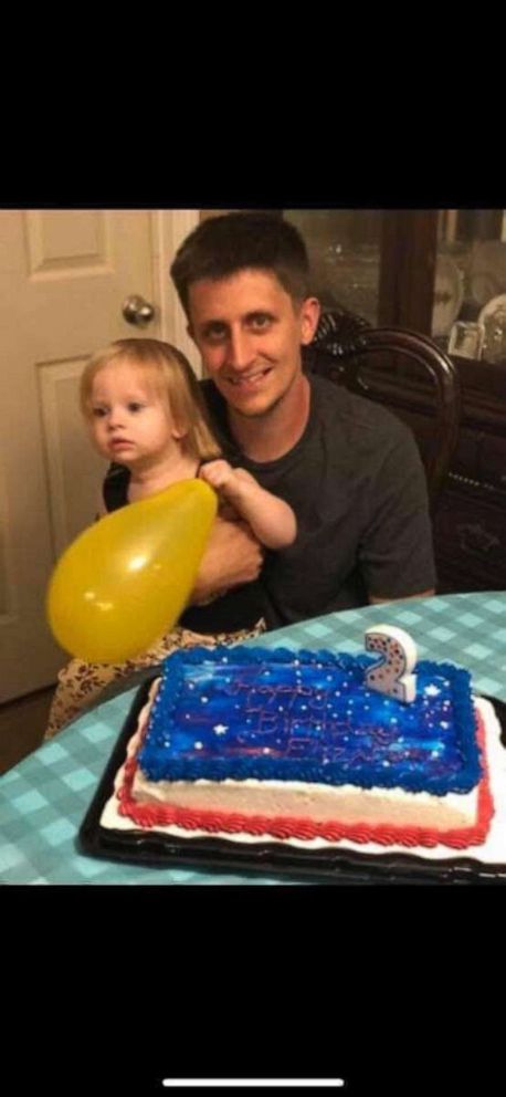PHOTO: Elizabeth Jones and her dad with her birthday cake. 