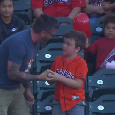 VIDEO: Dad catches Astros home run ball for son who tossed it back