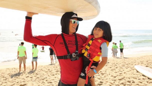 VIDEO: These pro surfers are using their sport to help kids with autism