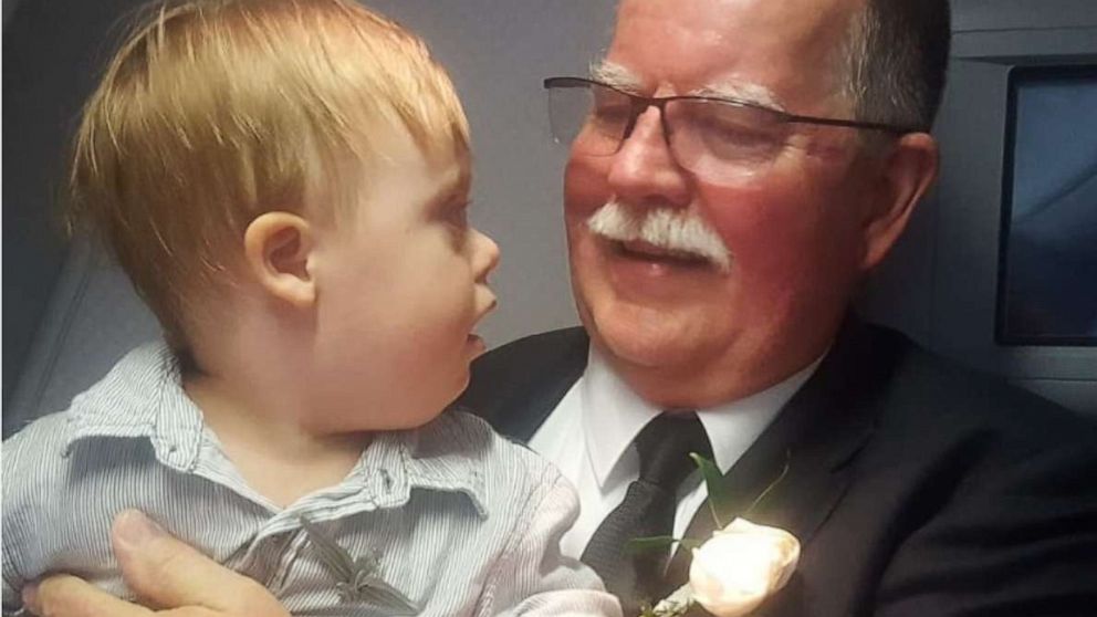 PHOTO: American Airlines pilot Joe Weis gave his captain's wings to two-year-old Ki Alsedek at the completion of his final flight. 