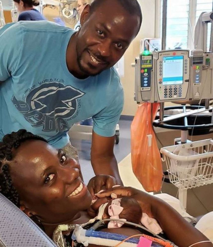 PHOTO: Ebonie Bender and her husband hold baby Kallie. 