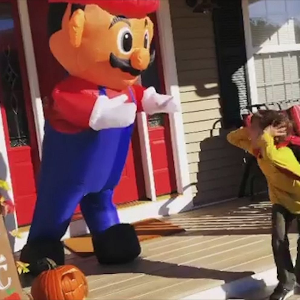 VIDEO: Mom hides in Super Mario blow up to scare her kid in epic Halloween prank 