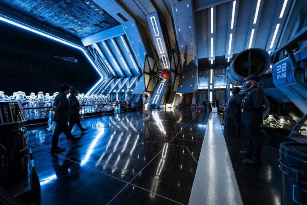 PHOTO: First Order troops and stormtroopers patrol the hangar bay of a Star Destroyer in Star Wars: Rise of the Resistance. Guests enter the hangar bay after their ship is caught in the Star Destroyer’s tractor beam in this  new Disney experience. 