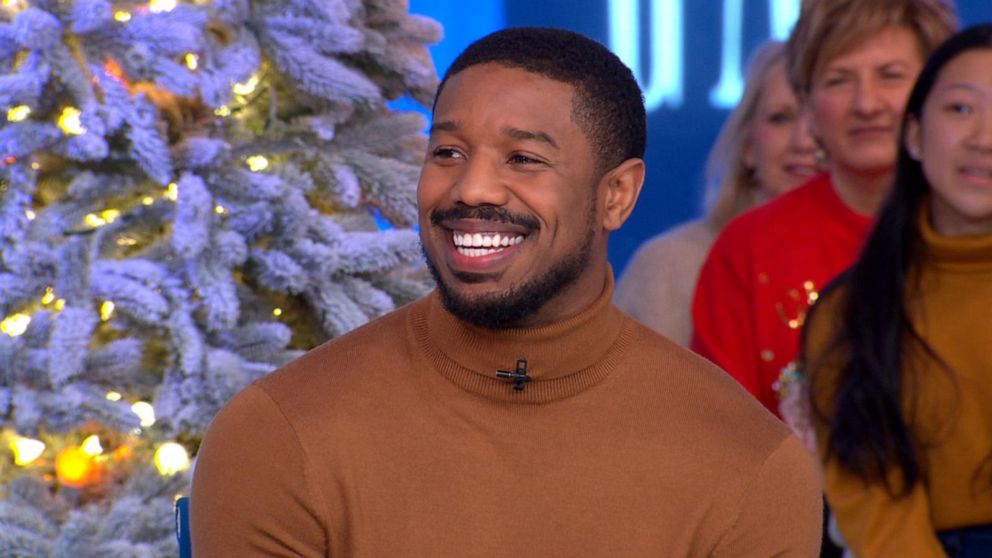 Actor Michael B. Jordan warms up on the sidelines before a