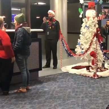 VIDEO: Passengers bring holiday cheer to airport by singing Christmas carols over PA system