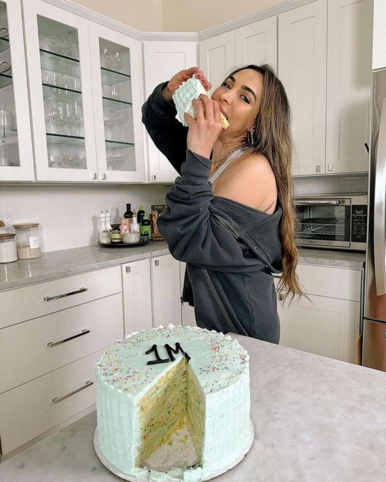 PHOTO: Nicole Keshishian Modic with a slice of cake to celebrate 1 million followers on Instagram.