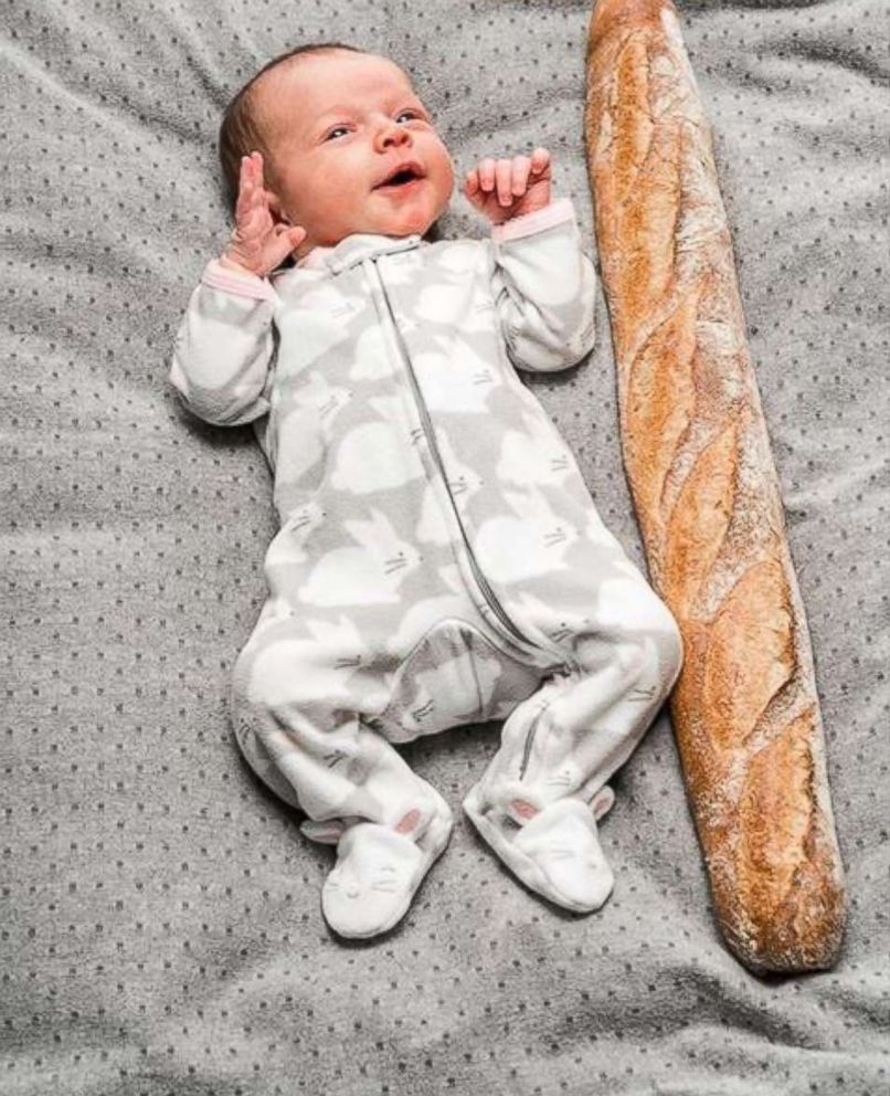 PHOTO: Michaela Claire Meter at one-month-old with a baguette loaf.