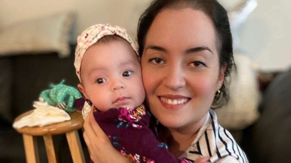 PHOTO: Serena Torres holds her daughter Alessandra while at home recovering from COVID-19.