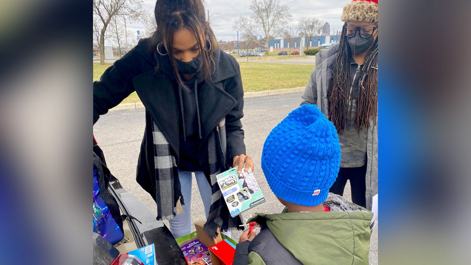 PHOTO: Janese Boston distributes a toy to a child during the "Build a Bond" toy drive she founded in Franklin County, Ohio.