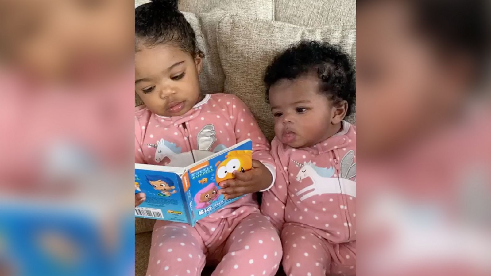 This 2-year-old girl trying to read to her little sister is too cute ...