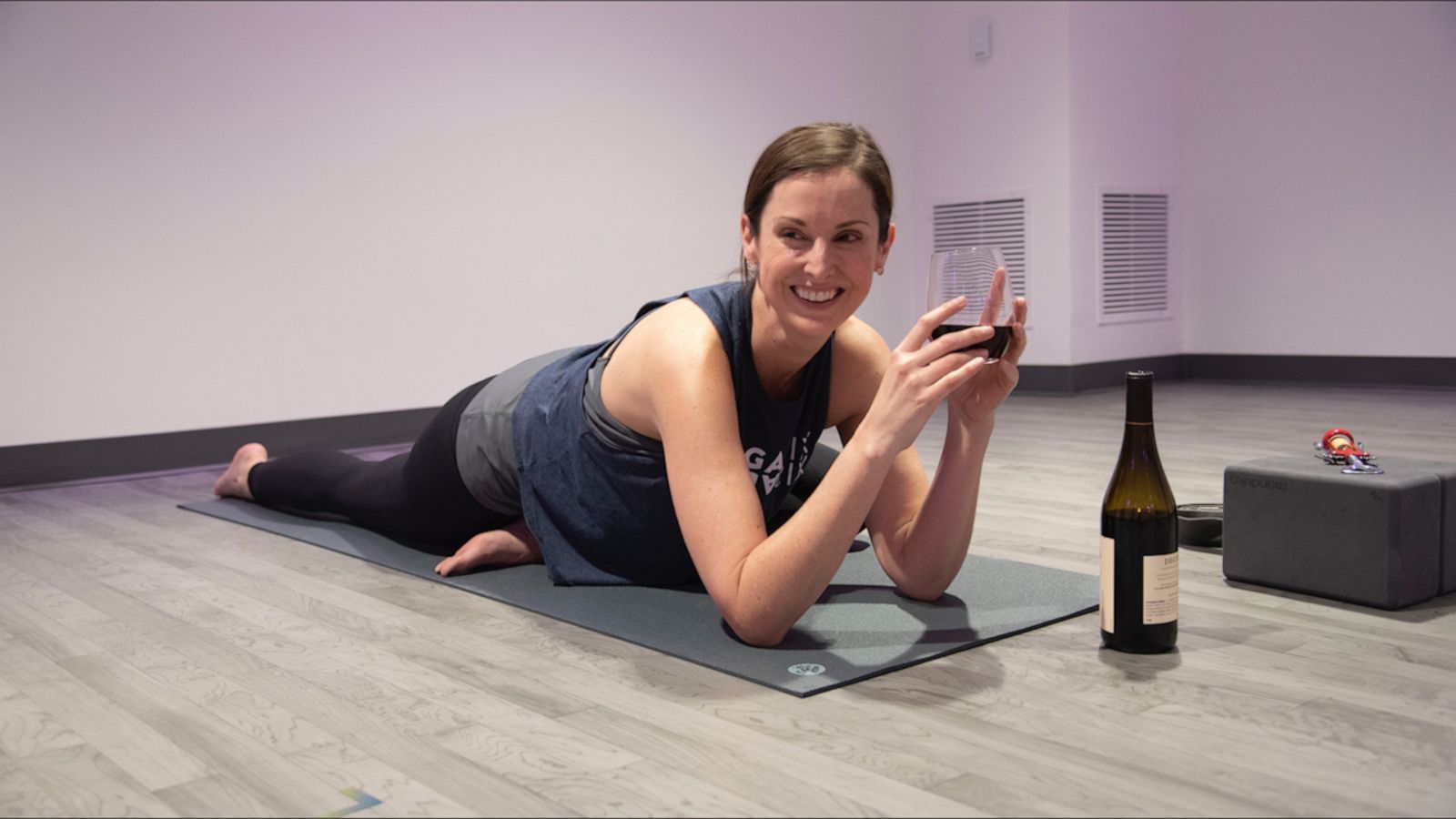 VIDEO: You can totally hold a wine glass or bottle with these wine-friendly yoga poses