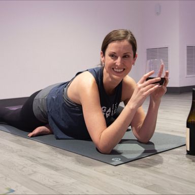 VIDEO: You can totally hold a wine glass or bottle with these wine-friendly yoga poses