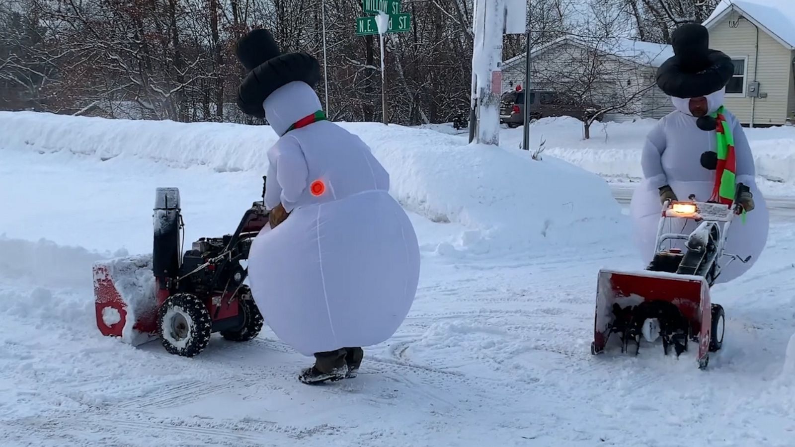 VIDEO: Snow-way did these neighbors dress up to plow their driveways