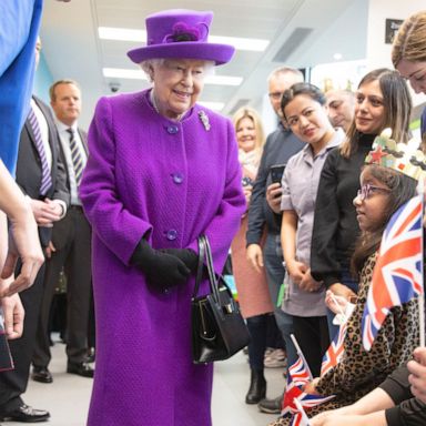 VIDEO: Queen Elizabeth meets girl with 2 cochlear implants during hospital visit 