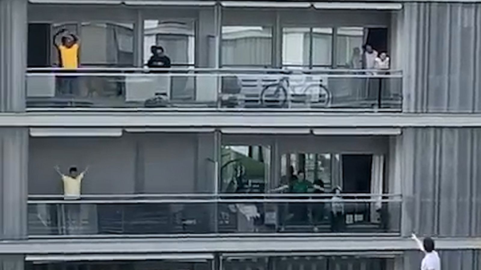 VIDEO: Quarantined residents in Spain take to their balconies for group exercise